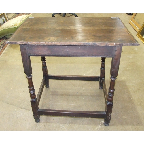 111 - An antique oak rectangular-top side table fitted with a single frieze drawer, on turned legs joined ... 