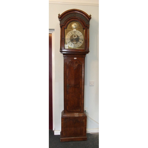 121 - Thomas Ogden, Halifax, an 18th century walnut long case clock, the brass arched dial with six-pillar... 