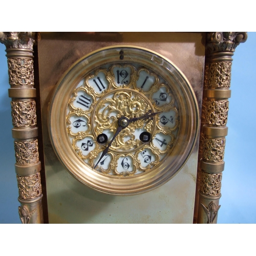 122 - A 19th century gilt metal mantel clock of architectural form, the domed case with decorative Corinth... 