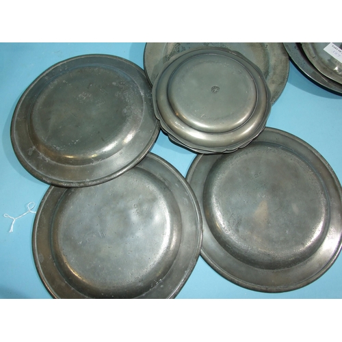 127 - Seven pewter plates, 14cm diameter, two others 8cm diameter and a salt with dog's head finial.... 