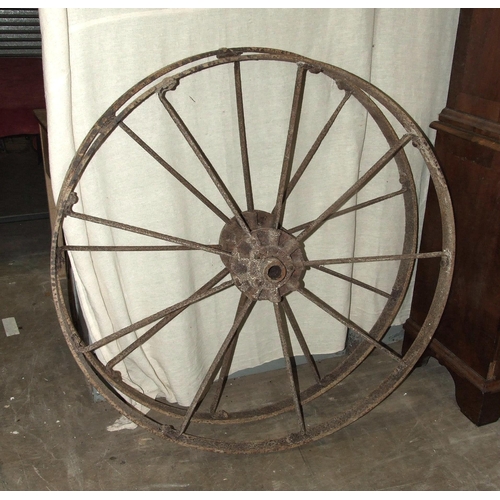 152 - A pair of vintage cast iron nine-spoke implement wheels embossed Bamfords, Uttoxeter to hubs, 112cm ... 