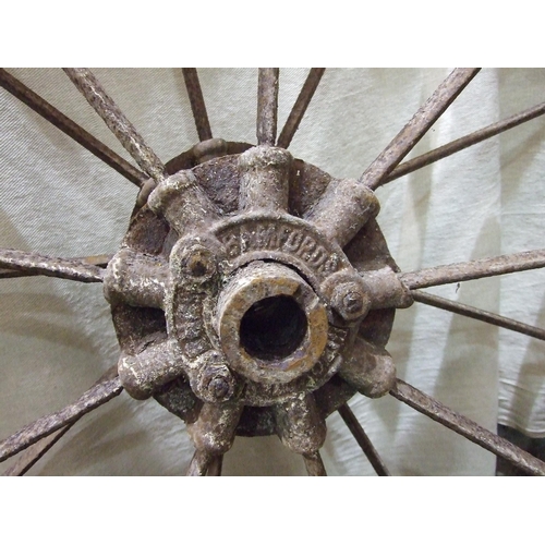 152 - A pair of vintage cast iron nine-spoke implement wheels embossed Bamfords, Uttoxeter to hubs, 112cm ... 