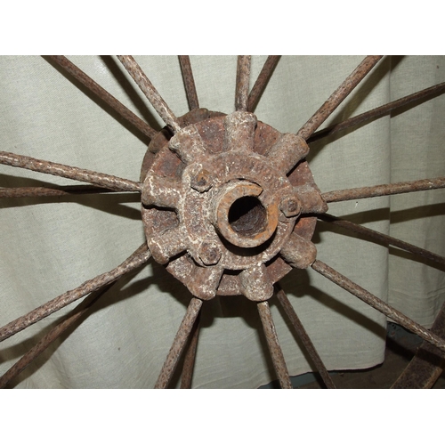 152 - A pair of vintage cast iron nine-spoke implement wheels embossed Bamfords, Uttoxeter to hubs, 112cm ... 