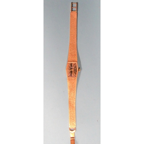 171 - A ladies' Marvin Revue 9ct gold wrist watch 1978, with integral tapered flexible bracelet, 26.3g, (w... 