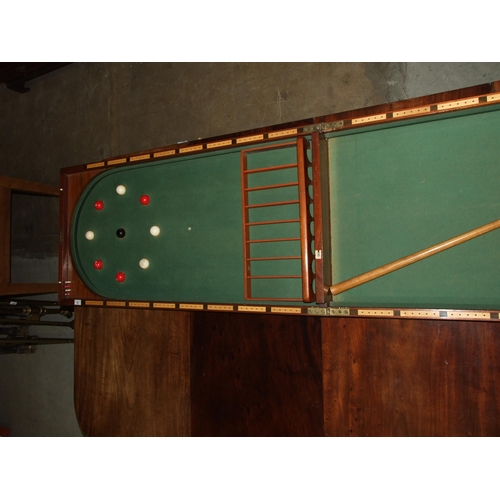 86 - A Victorian walnut folding bagatelle board, with balls and one cue, 242cm open, 121cm x 61cm closed.... 