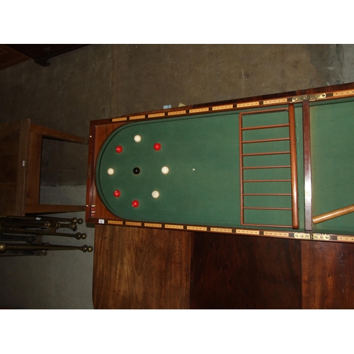 86 - A Victorian walnut folding bagatelle board, with balls and one cue, 242cm open, 121cm x 61cm closed.... 