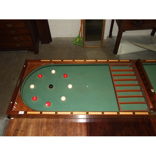 86 - A Victorian walnut folding bagatelle board, with balls and one cue, 242cm open, 121cm x 61cm closed.... 