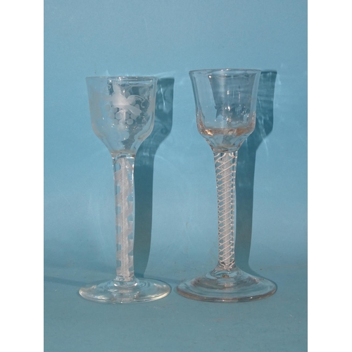 157 - Two 19th century ale glasses with air-twist stems, one engraved with fruits and vines, 15cm high, (2... 