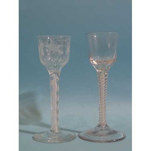 157 - Two 19th century ale glasses with air-twist stems, one engraved with fruits and vines, 15cm high, (2... 