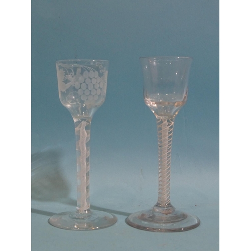 157 - Two 19th century ale glasses with air-twist stems, one engraved with fruits and vines, 15cm high, (2... 