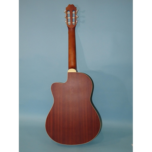 51 - A Chinese-made six-string guitar, model C4/4CE, a Yamaha Soprano descant recorder and two other reco... 