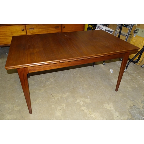 31 - A 1960's/70's hardwood draw-leaf dining table, 145 x 84cm closed, 241cm open and a set of six chairs... 