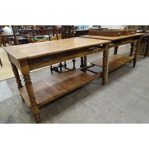 71 - A modern stained wood kitchen centre work table with four through-sliding drawers, the two-part top ... 