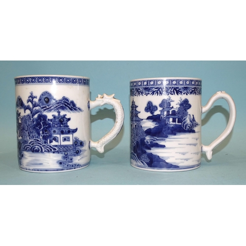 105 - Chinese 18th century, two similar blue and white Nankin tankards decorated with landscape scenes, 13... 