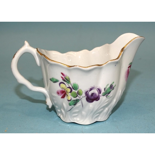 116 - A Worcester moulded flower-painted cream boat, 6.5cm high, 11cm long.