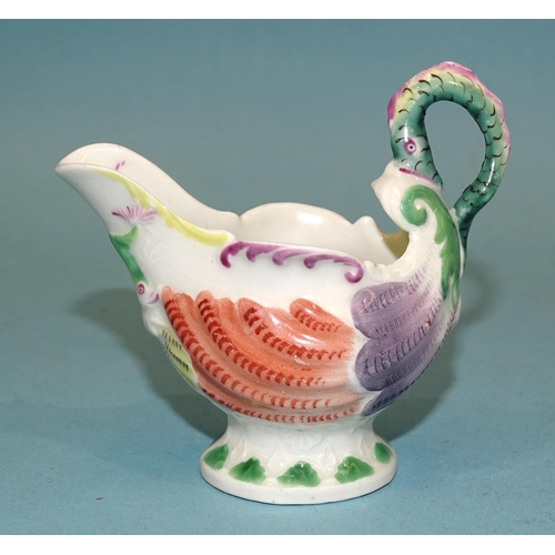 119 - A Derby? dolphin moulded cream boat with lamprey handle, 8cm high.