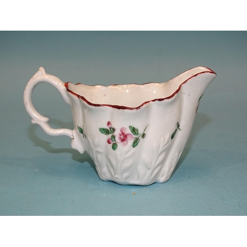 120 - A Bristol moulded cream boat, 7cm high, (handle cracked).