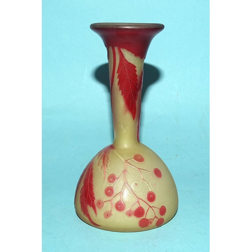 132 - A small cameo glass bud vase in mustard yellow opaque glass, with red overlay etched leaf and berry ... 