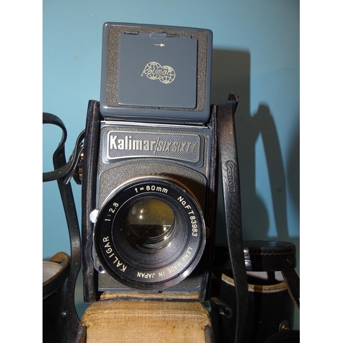 206 - A Kalimar Six Sixty FP-X SLR camera with Kaligar f2.8 80mm lens, in leather case and two cased lense... 