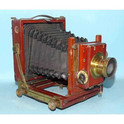 228 - A mahogany and brass quarter-plate camera, with Thornton Pickard shutter and lens.