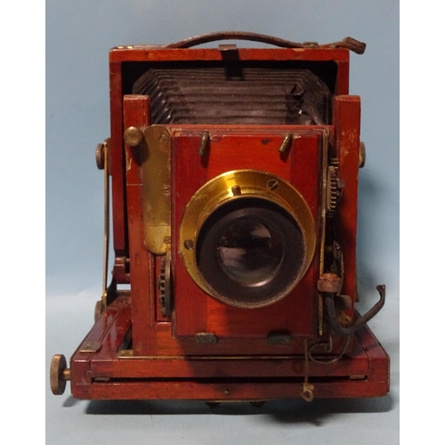 228 - A mahogany and brass quarter-plate camera, with Thornton Pickard shutter and lens.