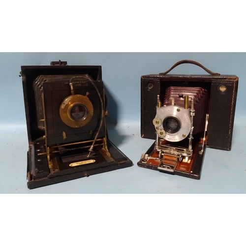 229 - A Lancaster Royal Instantograph half-plate camera, (back missing, a/f) and a Kodak half-plate camera... 