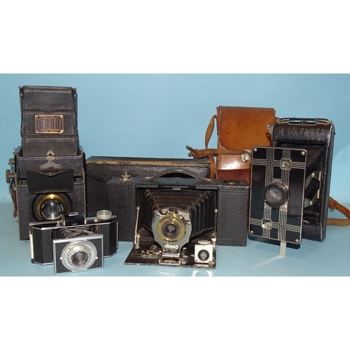 237 - Four Kodak folding cameras: Auto Graflex Jnr Reflex camera, a Brownie Automatic, a Jiffy Six-16 and ... 