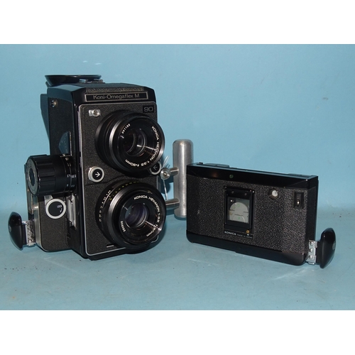 241 - A Konica Koni-Omegaflex M TLR camera, serial no.70207Y, with Konica Hexanon f3.5 90mm lenses and spa... 