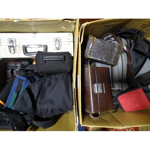 421 - A large quantity of camera bags, some leather.