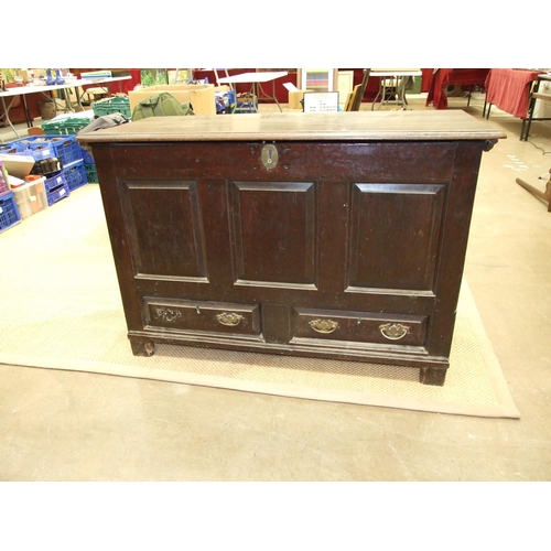 48 - An early-18th century oak mule chest, with hinged lid above three folded panels and two base drawers... 