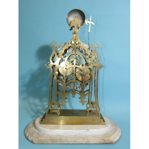 83 - A 19th century brass skeleton clock, the frame of simple Gothic design surmounted by trefoils and ra... 