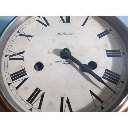 85 - A 20th century Celeste brass bulkhead clock striking on a bell, 20cm diameter.