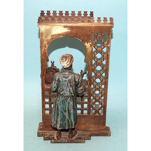 75 - A Bergman-style cold-painted bronze group depicting a pen and ink vendor at a shop window with canop... 