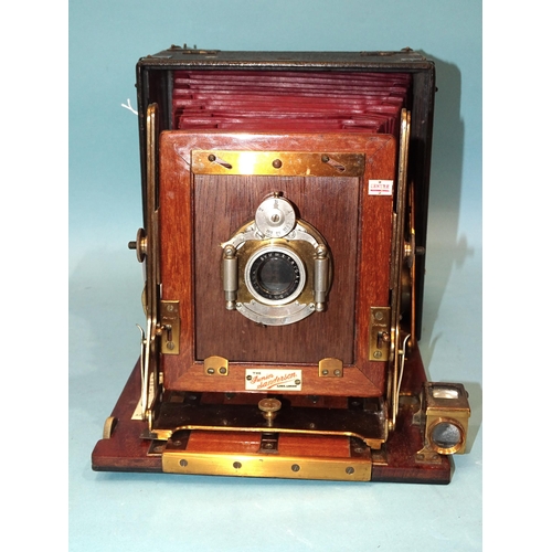 187 - A Junior Sanderson mahogany and brass plate camera with Beck Symmetrical lens, red leather bellows, ... 