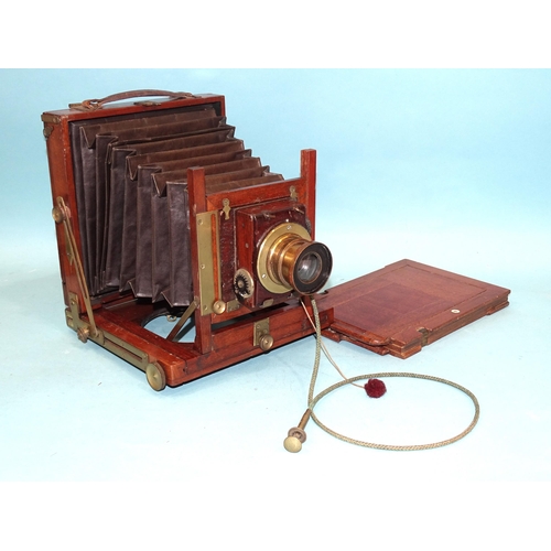 188 - A mahogany and brass half-plate field camera, unsigned, with brass lens, (shutter not working), with... 