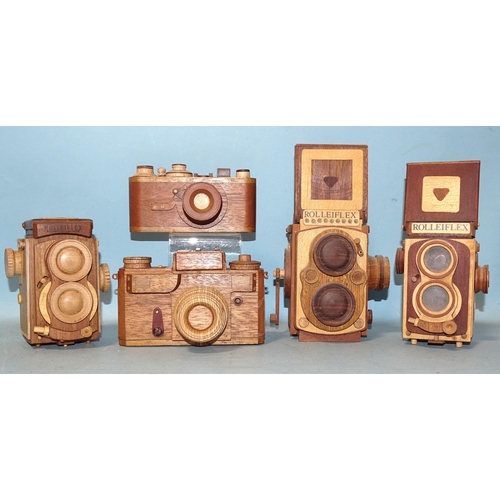 422 - Eight scratch-built wooden camera models: two Leicas, three Rolleiflex, a Canon Dial 35, a Kodak fol... 