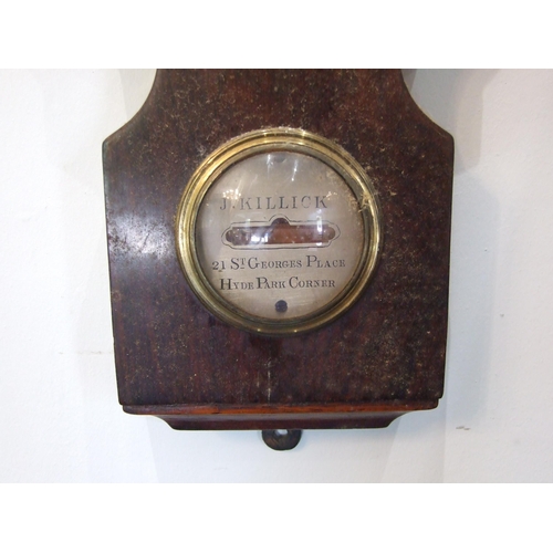 87 - A mahogany wheel barometer, the narrow case with silvered dry/damp, thermometer and spirit level dia... 