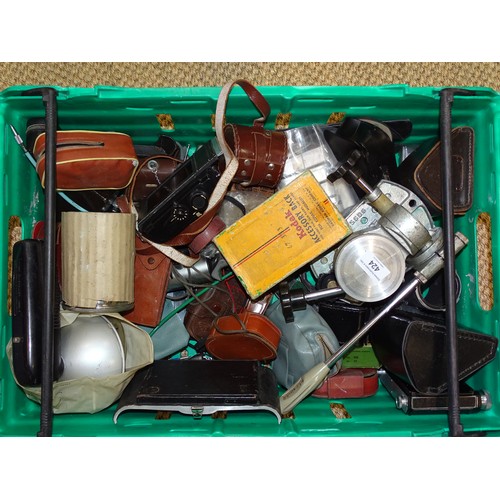 424 - A large quantity of vintage camera accessories, including camera backs, meters, viewfinders, etc.... 