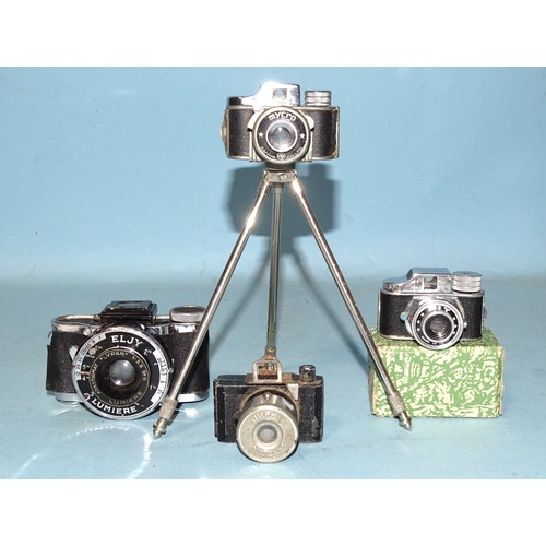 An Eljy Lumiere sub-miniature camera, a Japanese Mycro camera on tripod, a Japanese "Hit" camera in original box and another sub-miniature camera (a/f), (4).