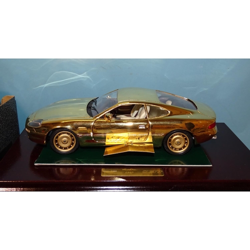 82 - Guiloy, a 1:18 scale Aston Martin DB7 and a Revell 1:12 '54 Mercedes 300SLR, (both boxed with plinth... 