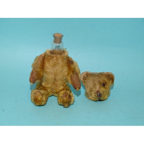 200 - Schuco, a miniature teddy bear/scent bottle with golden plush, bottle intact with cork, (one me... 