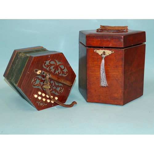 530A - A twenty-one key rosewood concertina with tooled leather and paper bellows, in fitted box.... 