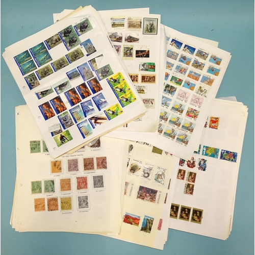 30 - An accumulation of stamps in a stock book and on leaves.