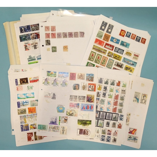 30 - An accumulation of stamps in a stock book and on leaves.