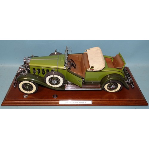 Danbury Mint, Museum Masterpiece, 1930 Cadillac V16 Roadster, serial no.1968, 1:12 scale model, including golfer's door, golf bag and clubs, folding roof with cover, fine engine detail, (three hub caps detached, two present, one exhaust end detached but present), 46cm long, on wooden plinth, (no box).