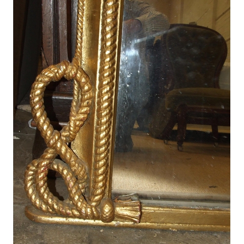 21 - A large Victorian over-mantel mirror, the gilt frame with rope moulding tied in a knot at the base, ... 