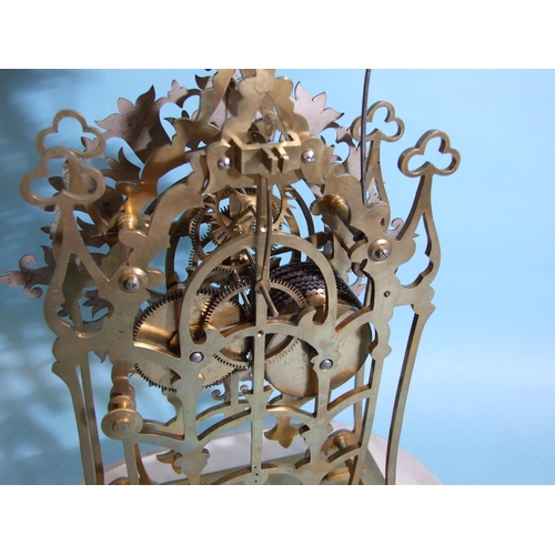 127 - A 19th century brass skeleton clock, the frame of simple Gothic design surmounted by trefoils and ra... 