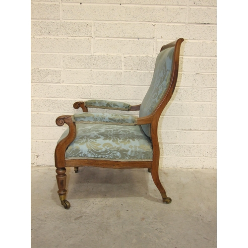 1 - An early-19th century rosewood library chair, the curved back with upholstered centre to partially-u... 