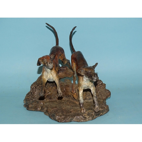 103 - Sally Rutherford (b.1940), a cold-painted bronze sculpture of two hounds leaping over a fallen tree ... 