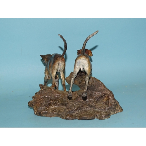 103 - Sally Rutherford (b.1940), a cold-painted bronze sculpture of two hounds leaping over a fallen tree ... 